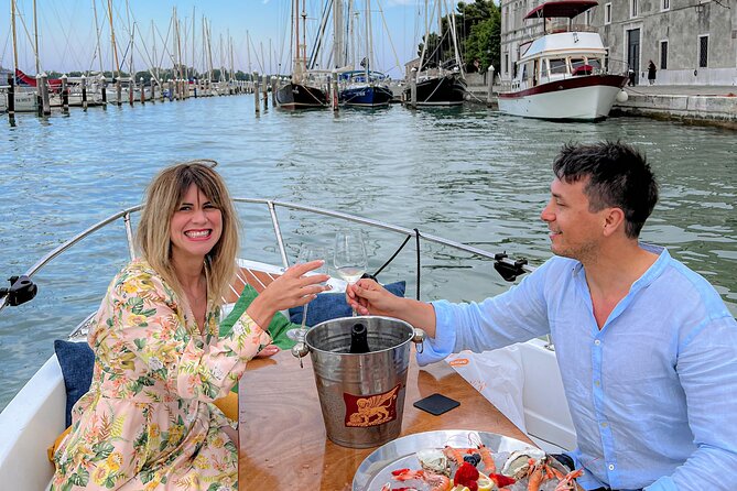 Cena at Gatto Nero (or Hosteria)with SunSet Cruise Around Burano - A sunset aperitif on the water, with Davide driving the vibe