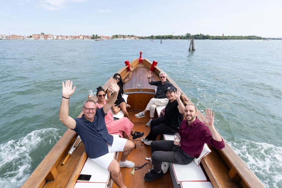 Check out Venice from a different angle: a scenic tour on a traditional boat. - San Marco basin photo stops without the walk-and-queue grind