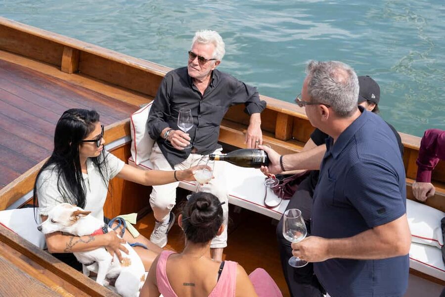 Check out Venice from a different angle: a scenic tour on a traditional boat. - Time on the water: is one hour enough?