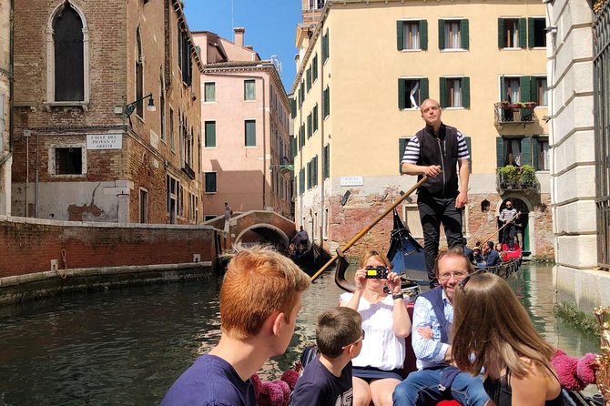Doge's Palace guided tour and Gondola ride - Shared gondola ride on calmer canals: traditional, but plan for the headset setup