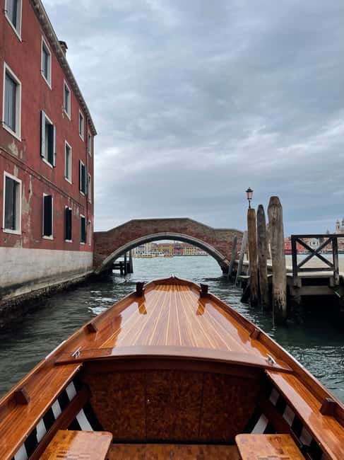 Hop on board an old Venetian boat - Ponte Longo to Il Redentore, and Punta della Dogana from the water