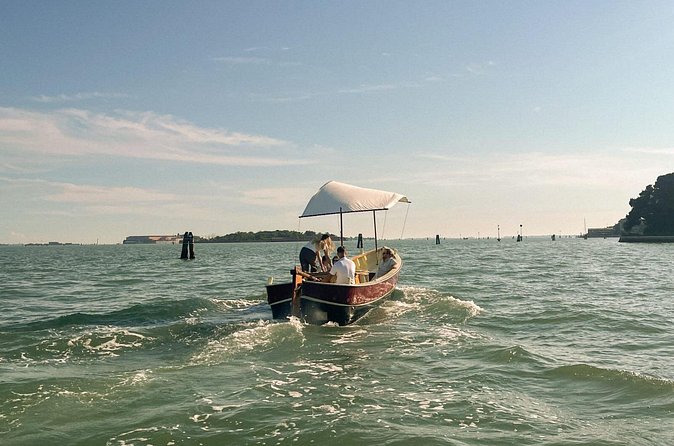 Sunset in a typical boat in Venice - The slow ride advantage: comfort for your feet and time for your photos