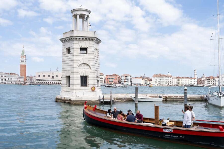 Venice at sunset: tour in a historic 1955 bragozzo with an aperitif - Lido time, the southern lagoon islands, and views behind major hotels