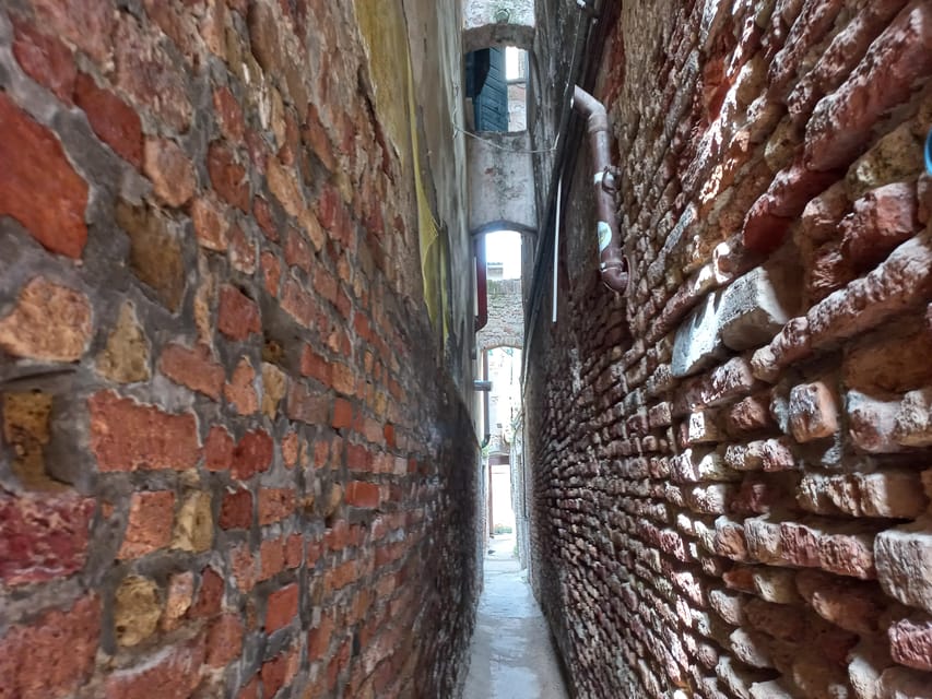 Venice Small-Group Walking Tour: Secrets & Hidden Gems - The Jewish Ghetto photo stop, with context in the background